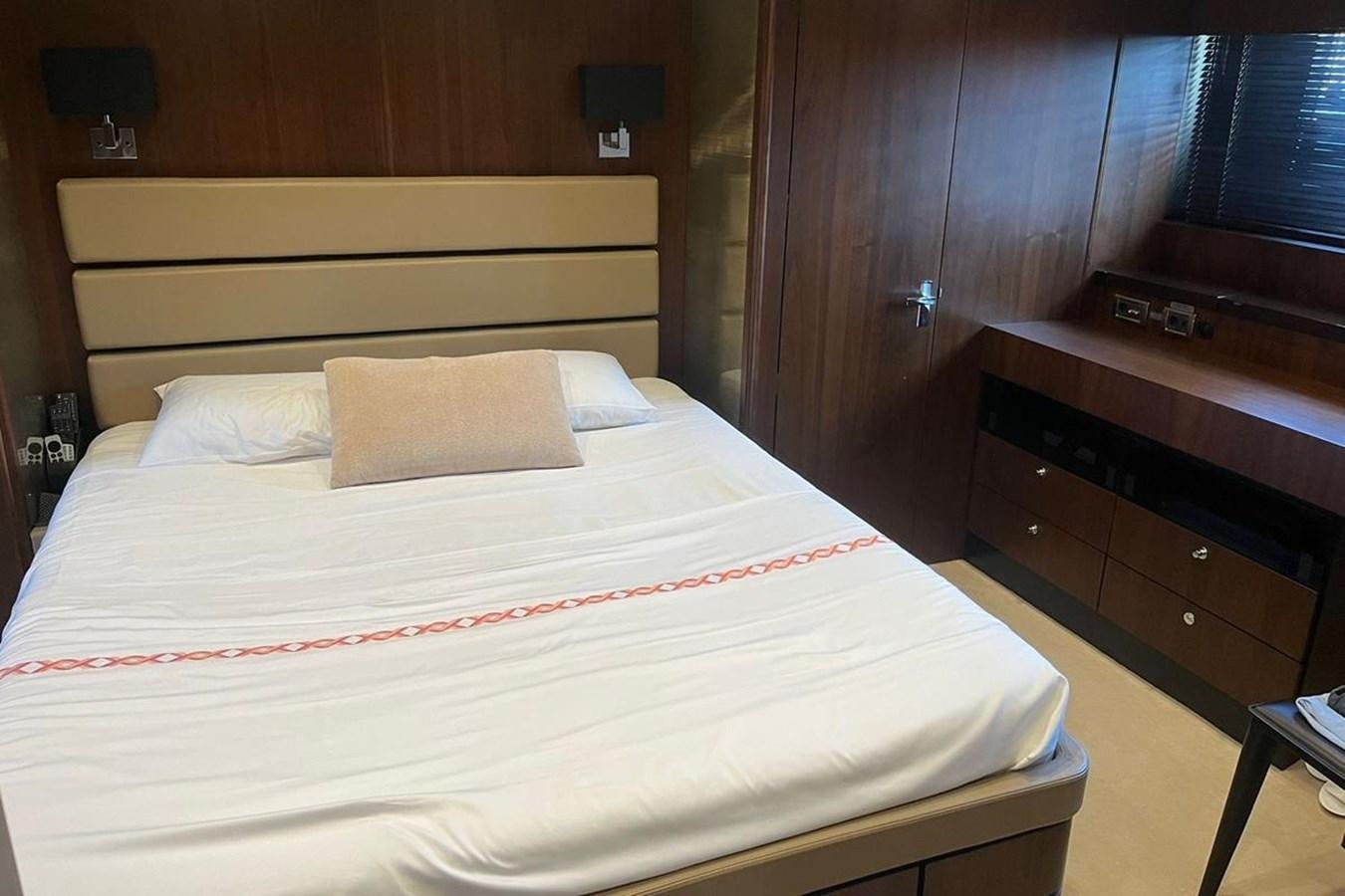 a bed with white sheets aboard FAIRLINE SQUADRON 78 2015 Yacht for Sale
