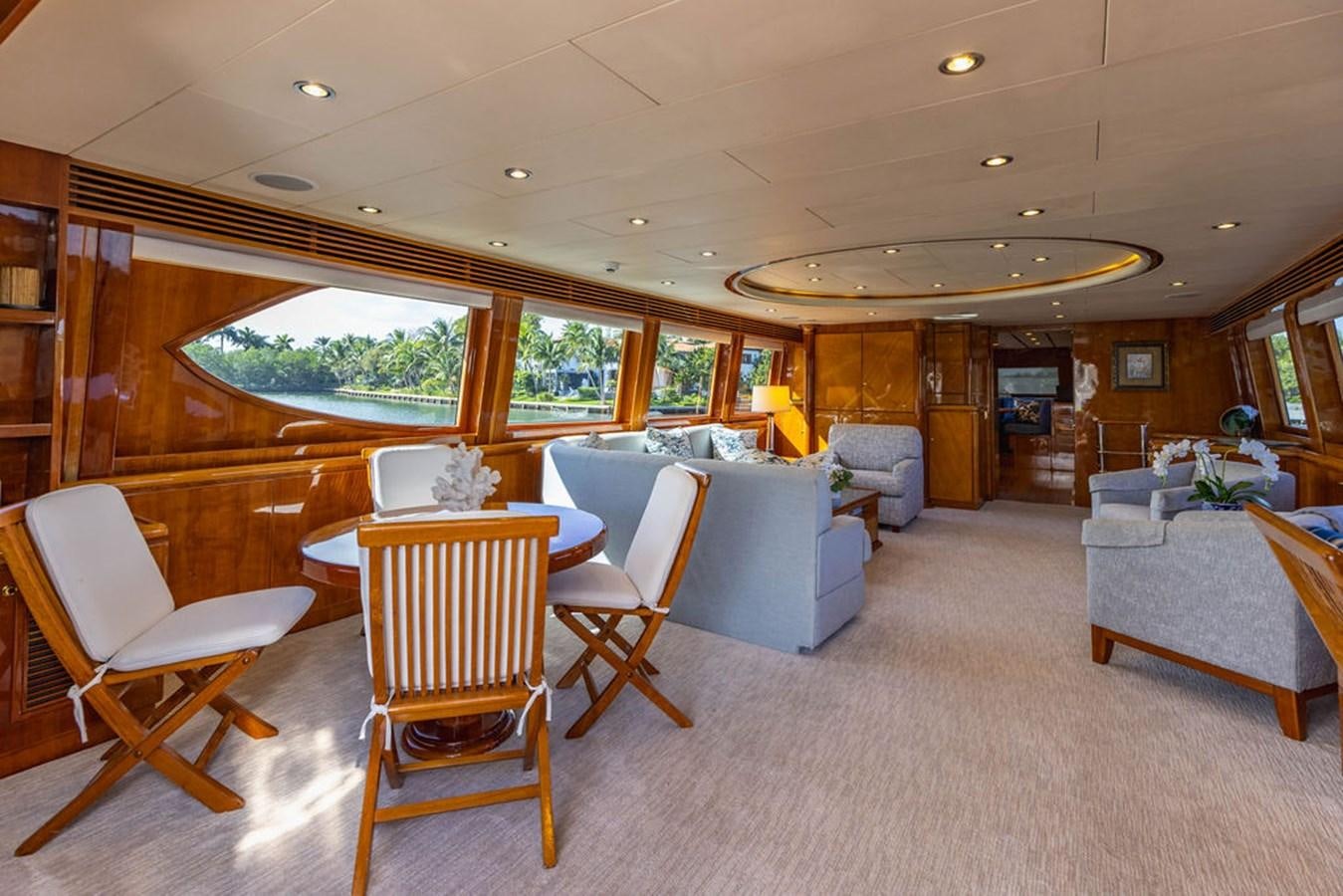 a living room with a couch and chairs aboard NO REGRETS Yacht for Sale