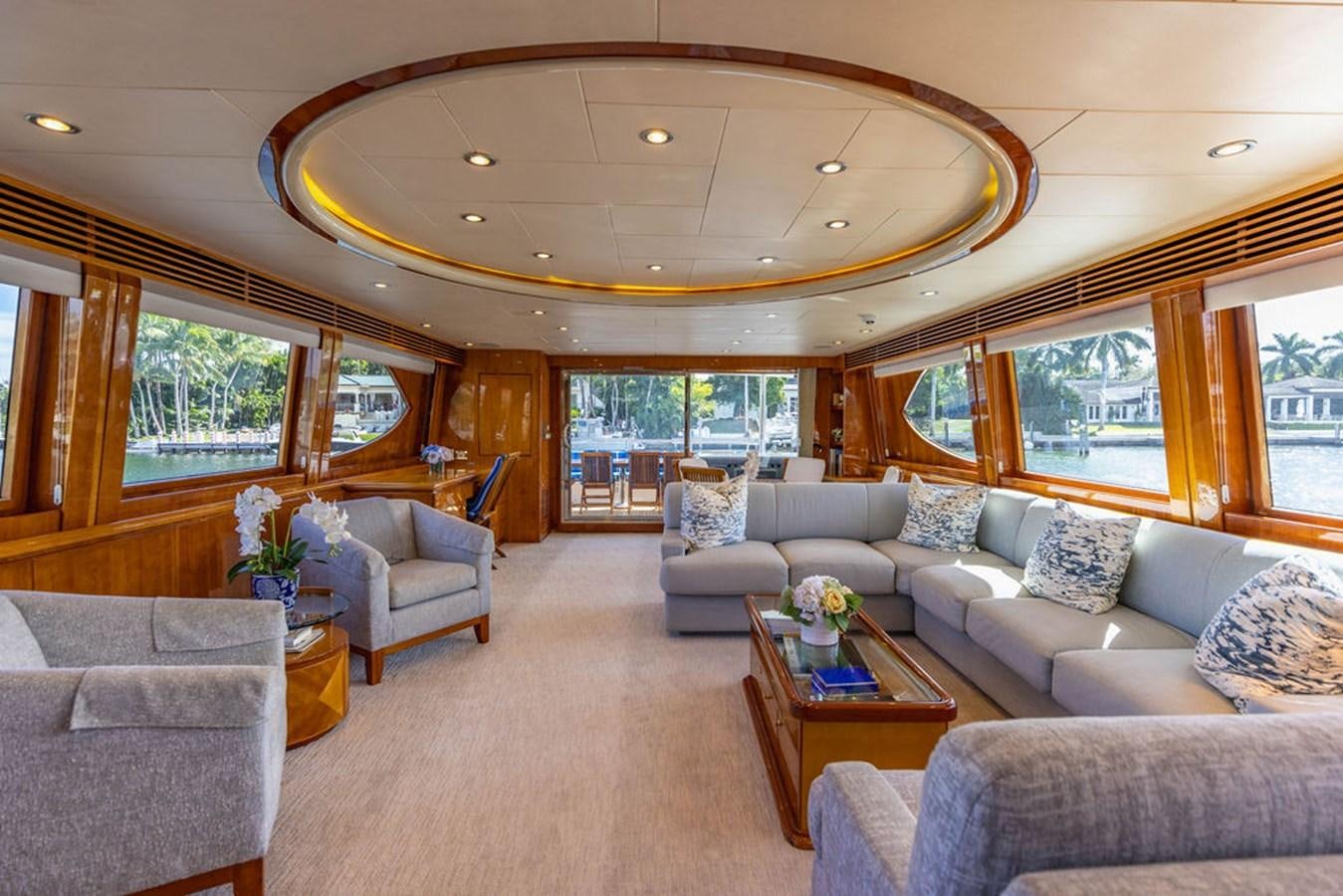 a living room with a large window aboard NO REGRETS Yacht for Sale