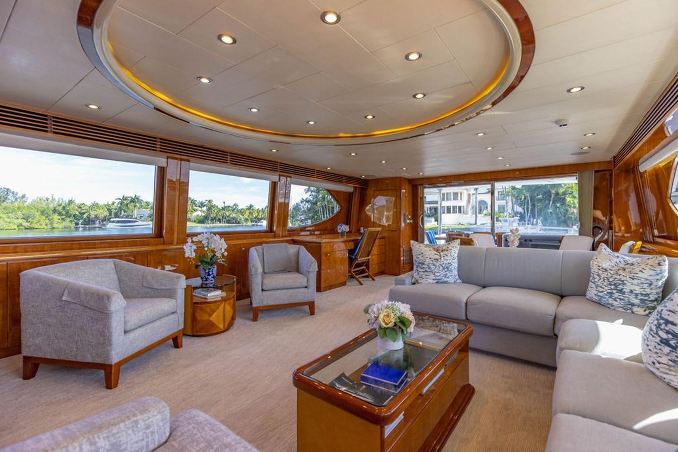 a living room with a large window aboard NO REGRETS Yacht for Sale