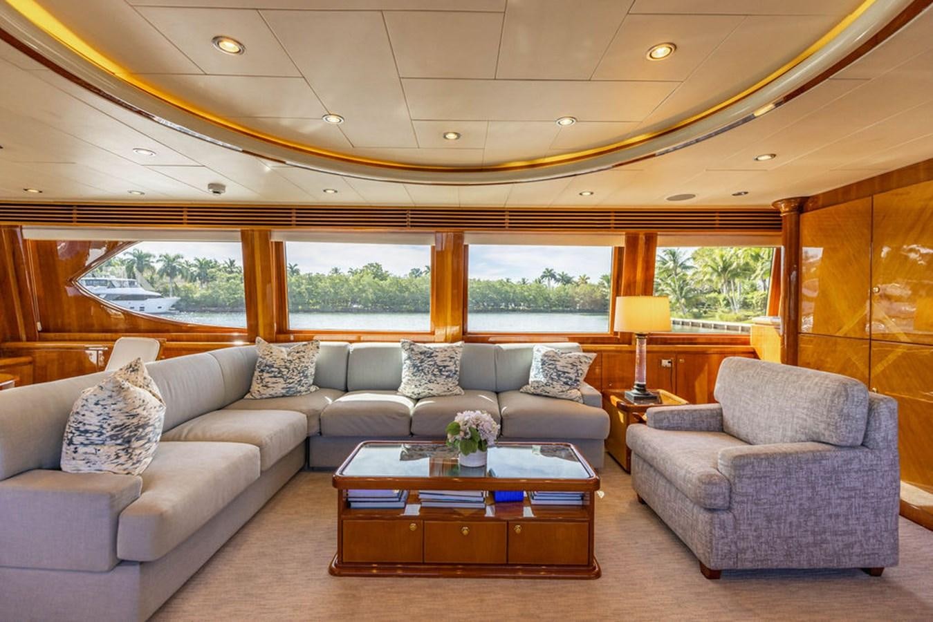 a living room with a couch and a coffee table aboard NO REGRETS Yacht for Sale
