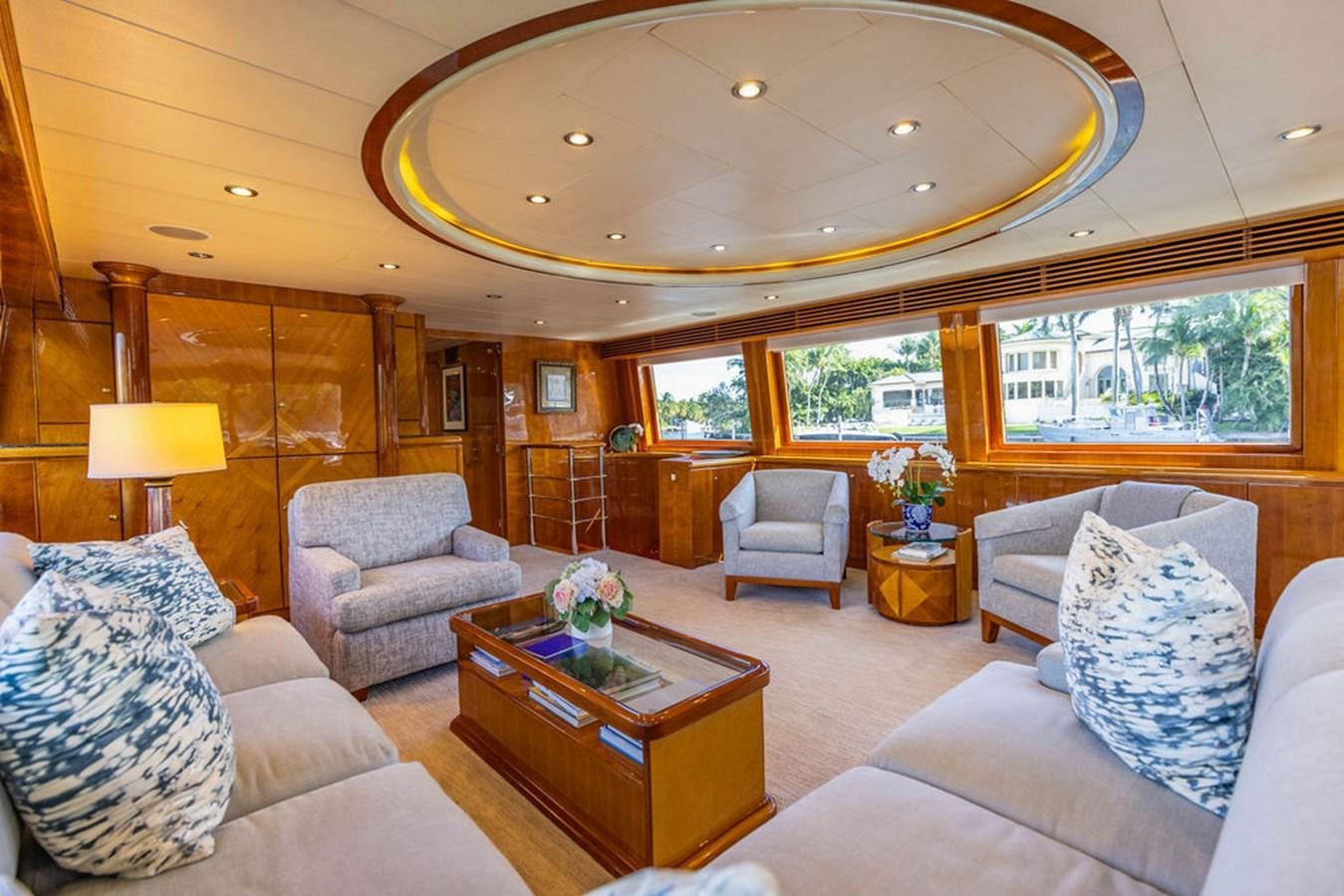 a living room with a large open window aboard NO REGRETS Yacht for Sale