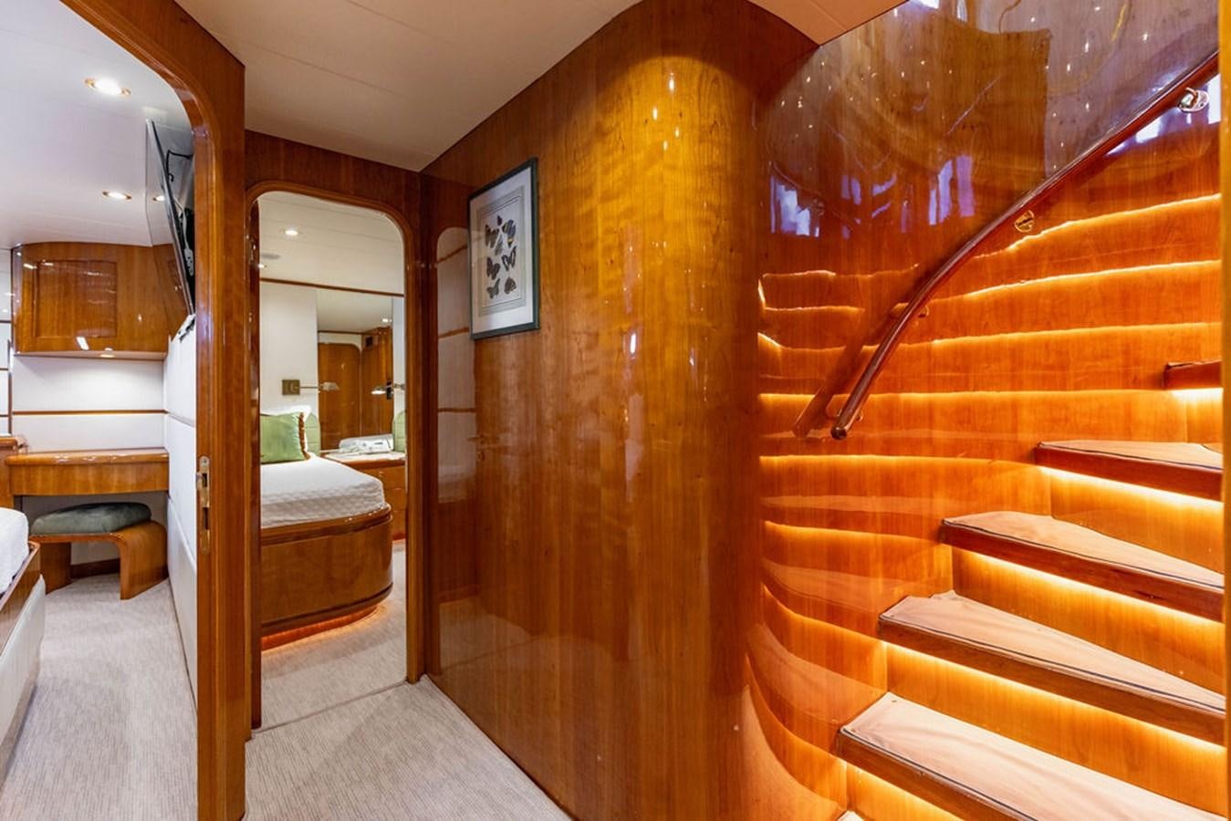 a room with wooden stairs aboard NO REGRETS Yacht for Sale