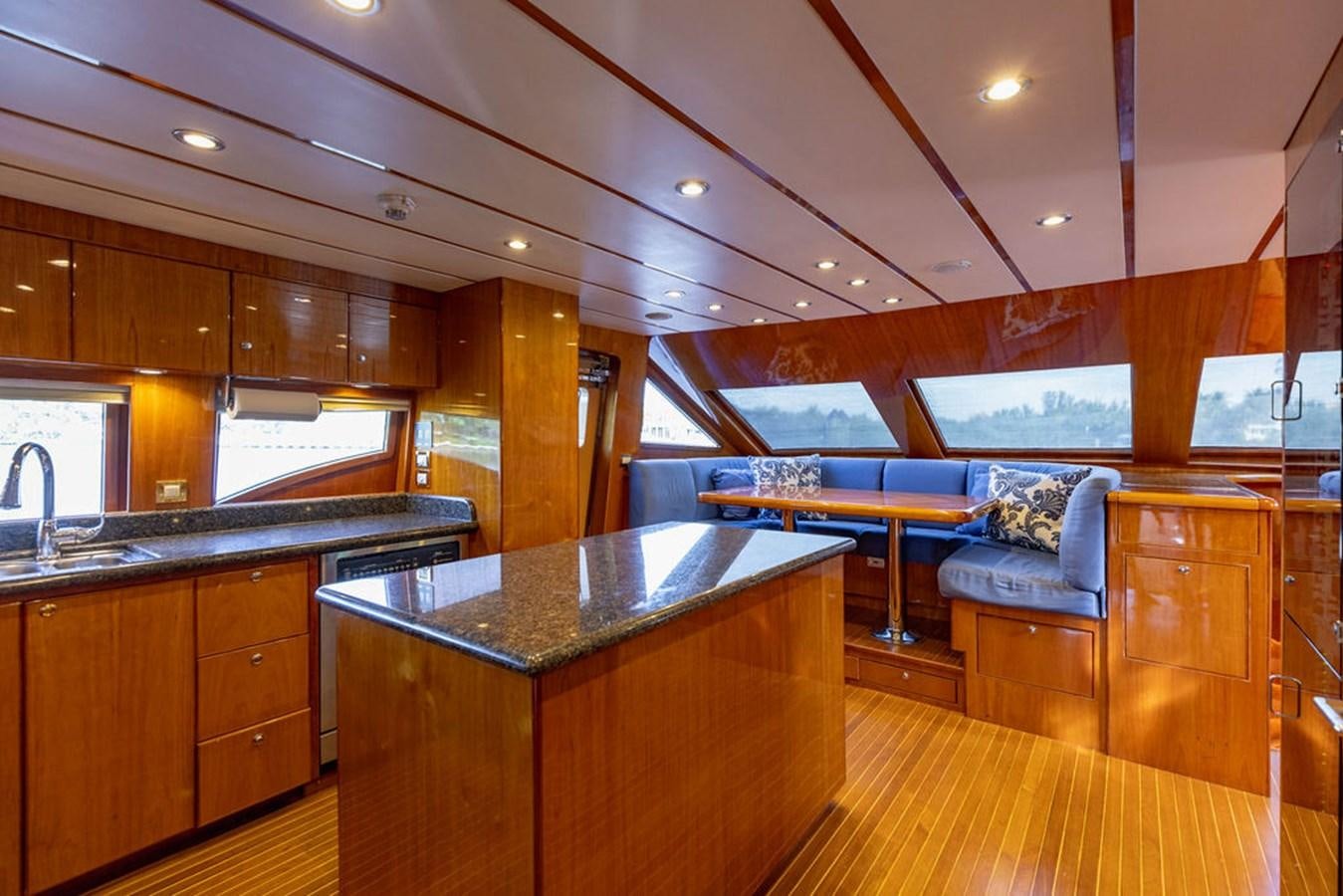 a kitchen and living room area aboard NO REGRETS Yacht for Sale