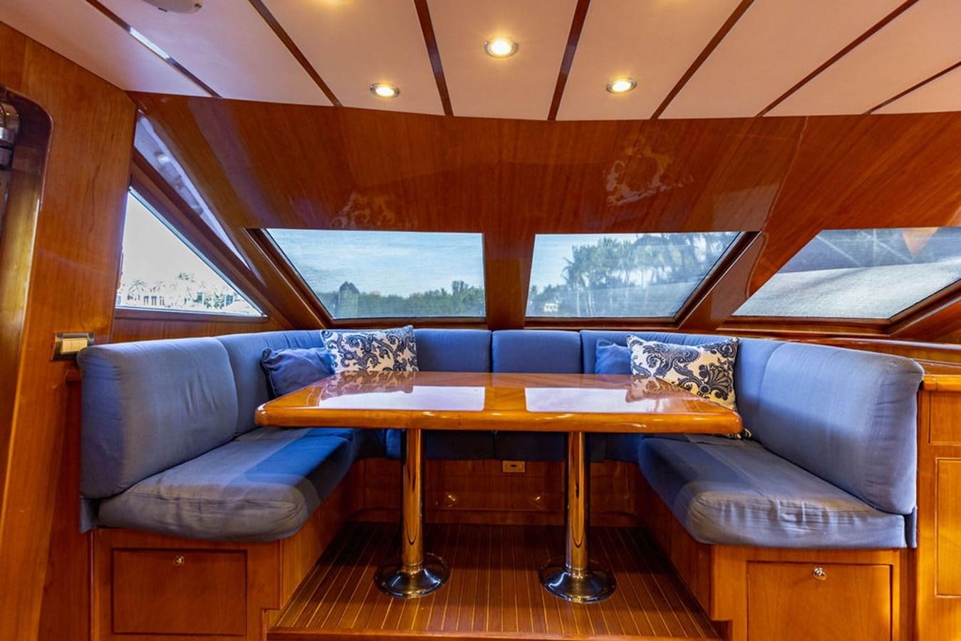 a room with a couch and a table aboard NO REGRETS Yacht for Sale