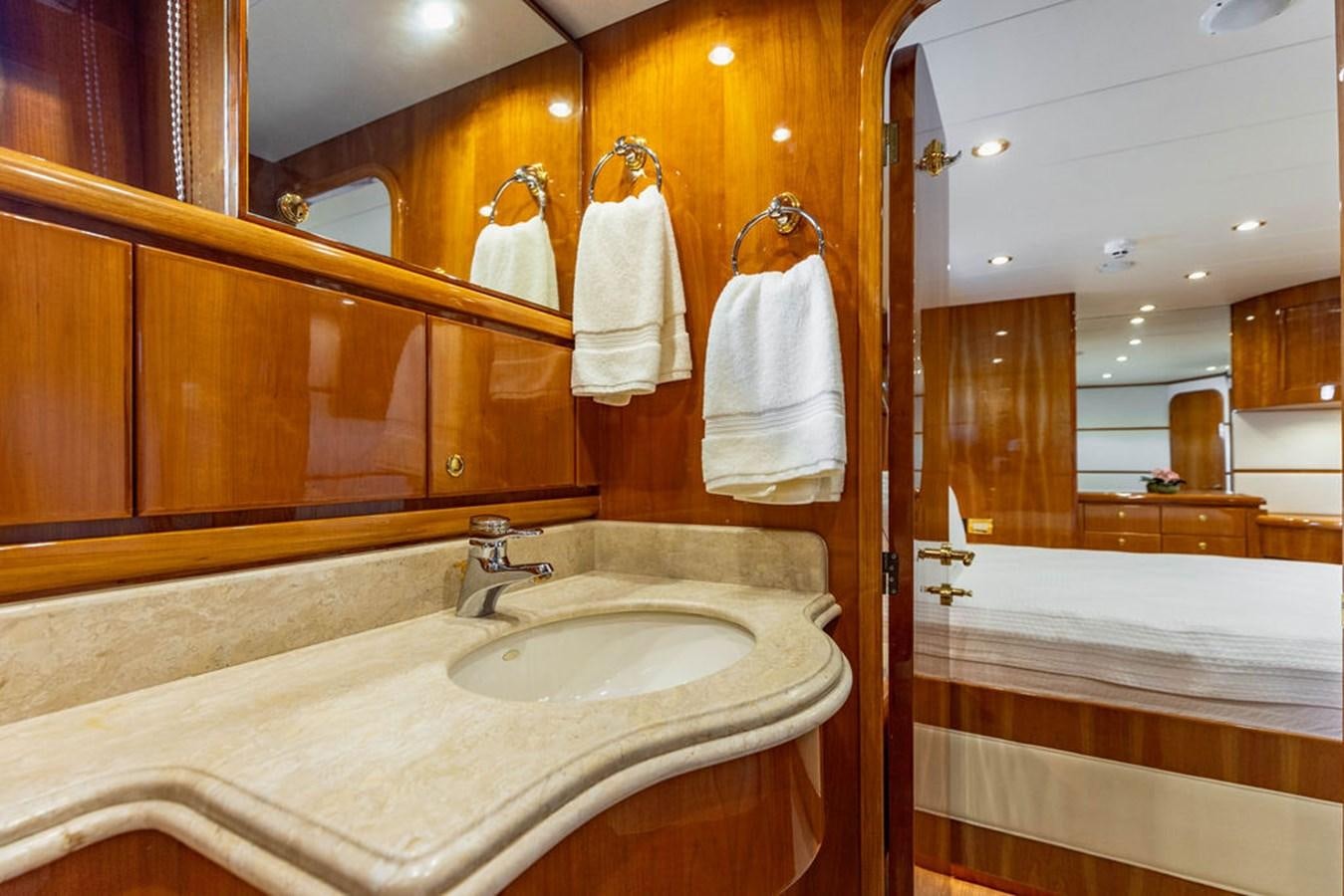 a bathroom with a sink and a mirror aboard NO REGRETS Yacht for Sale