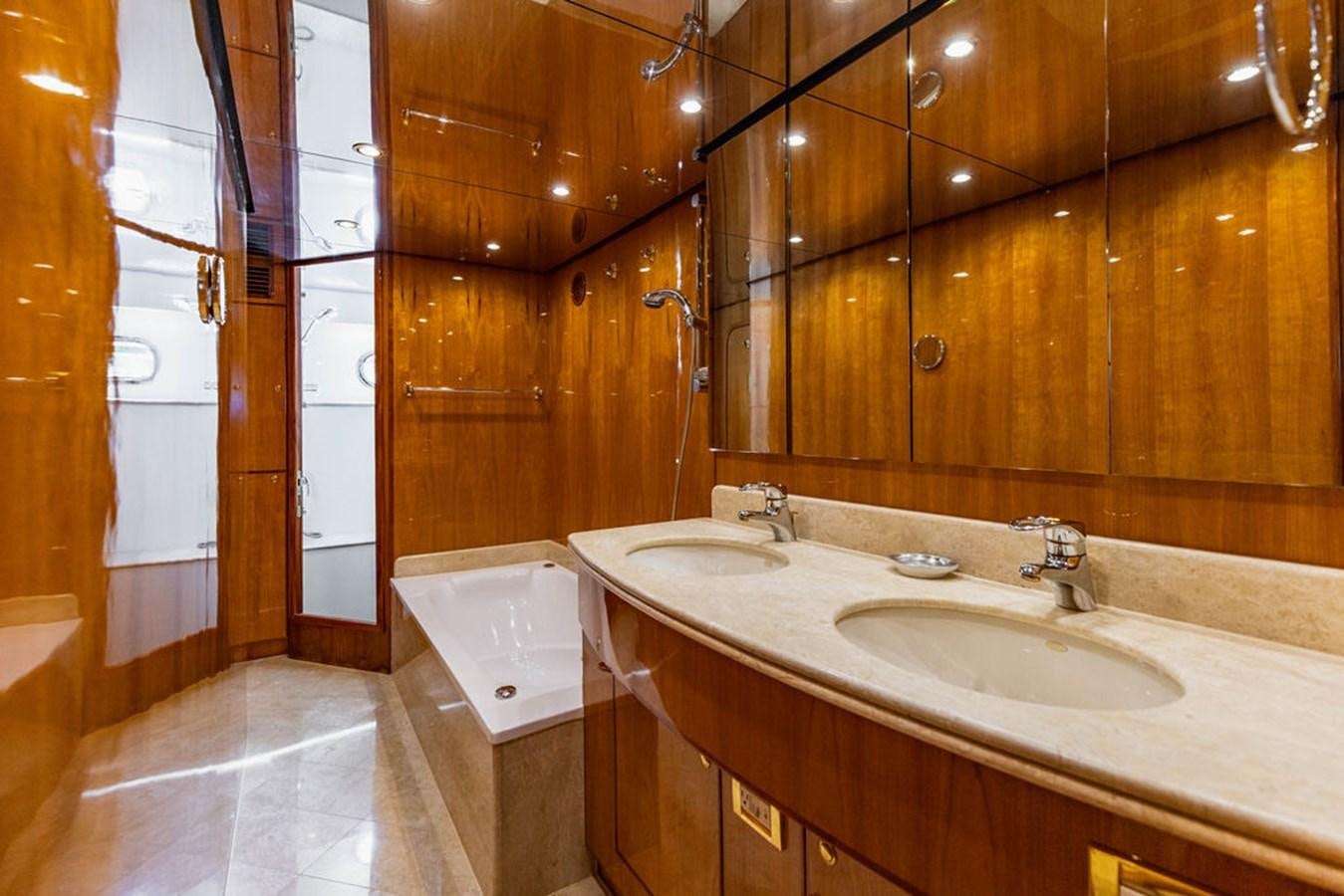 a bathroom with a sink and a bathtub aboard NO REGRETS Yacht for Sale