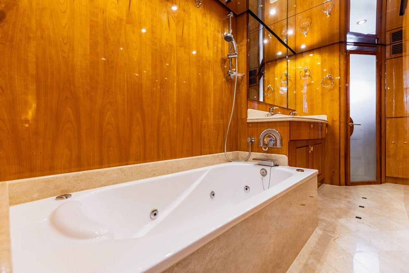 a bathroom with a bathtub aboard NO REGRETS Yacht for Sale