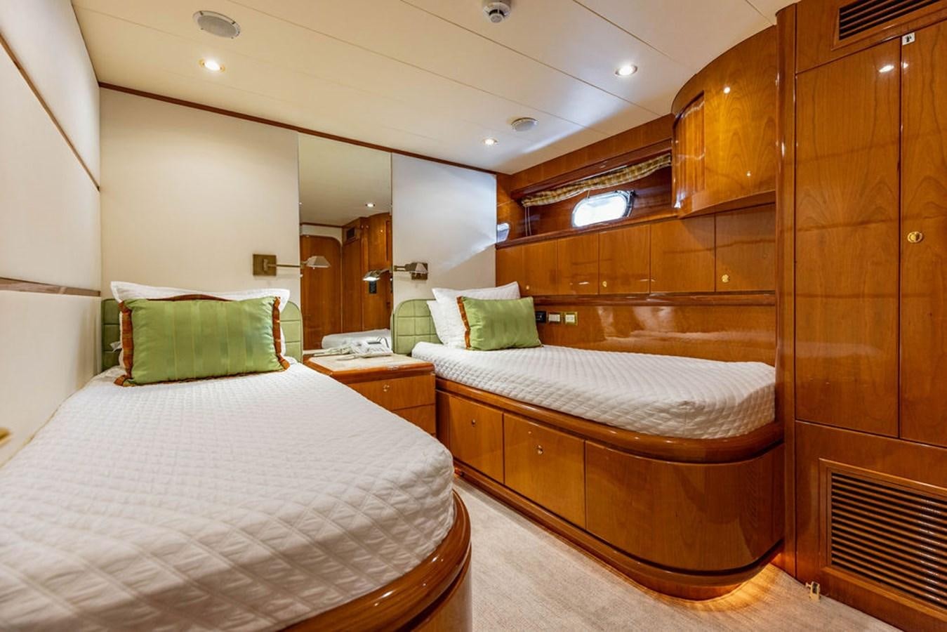 a couple of beds in a hotel room aboard NO REGRETS Yacht for Sale