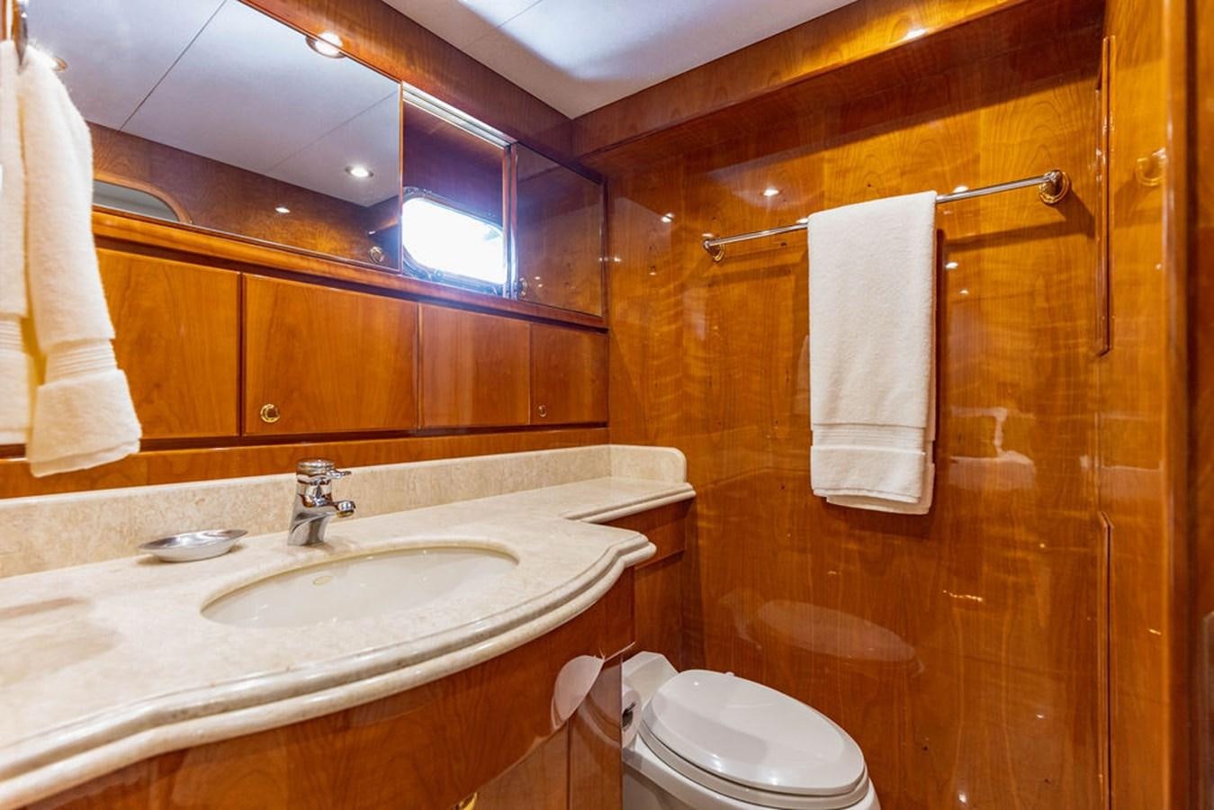 a bathroom with a sink and toilet aboard NO REGRETS Yacht for Sale