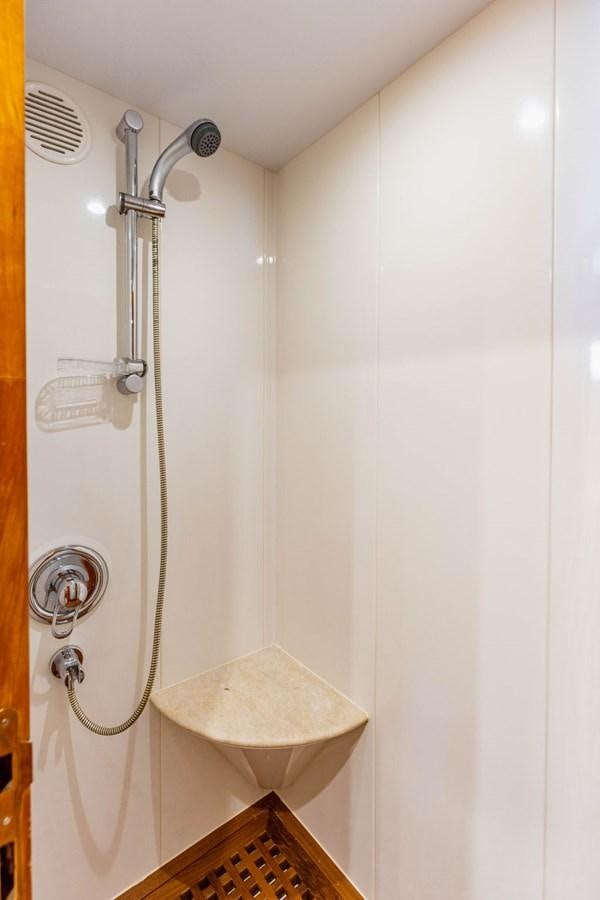 a shower with a toilet aboard NO REGRETS Yacht for Sale
