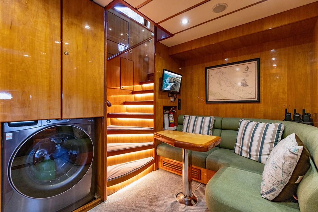a living room with a large mirror aboard NO REGRETS Yacht for Sale