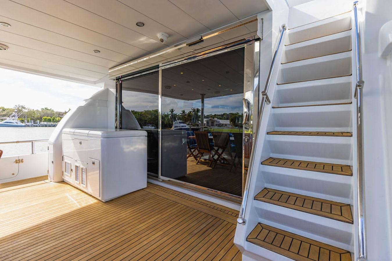 a room with a sliding glass door aboard NO REGRETS Yacht for Sale