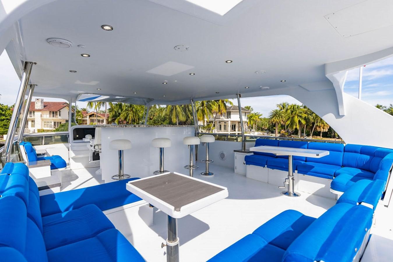 a room with a pool table and chairs aboard NO REGRETS Yacht for Sale