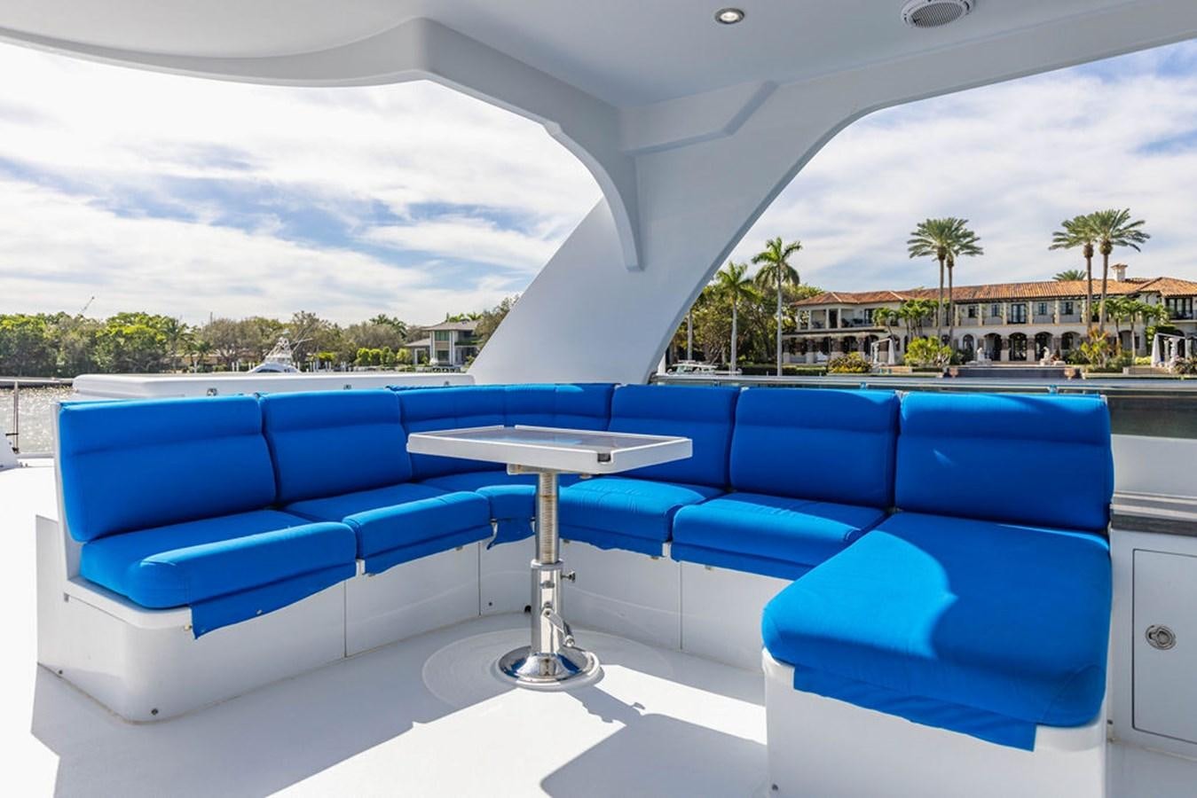 a lounge area with a pool aboard NO REGRETS Yacht for Sale