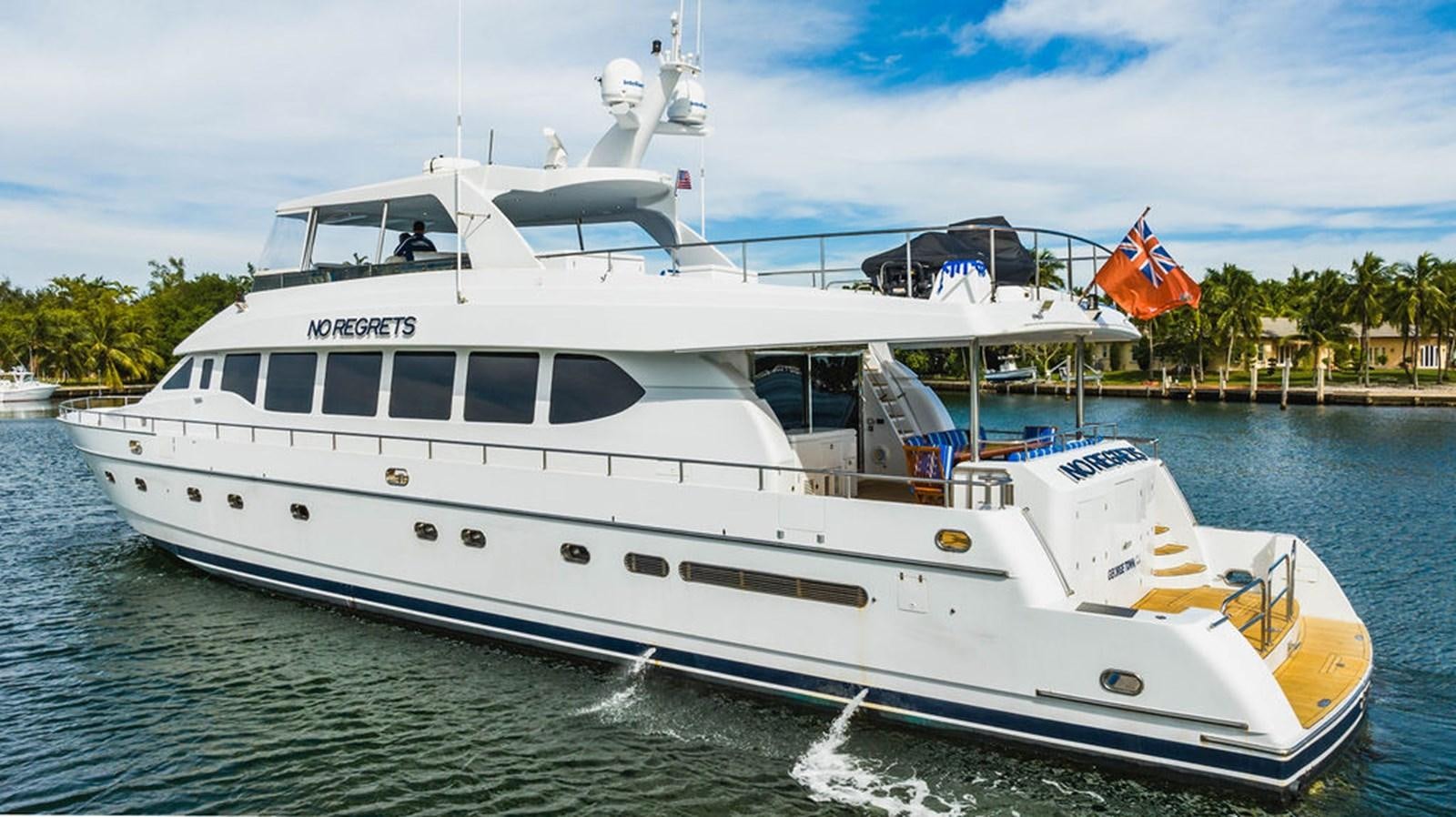 a white yacht on the water aboard NO REGRETS Yacht for Sale