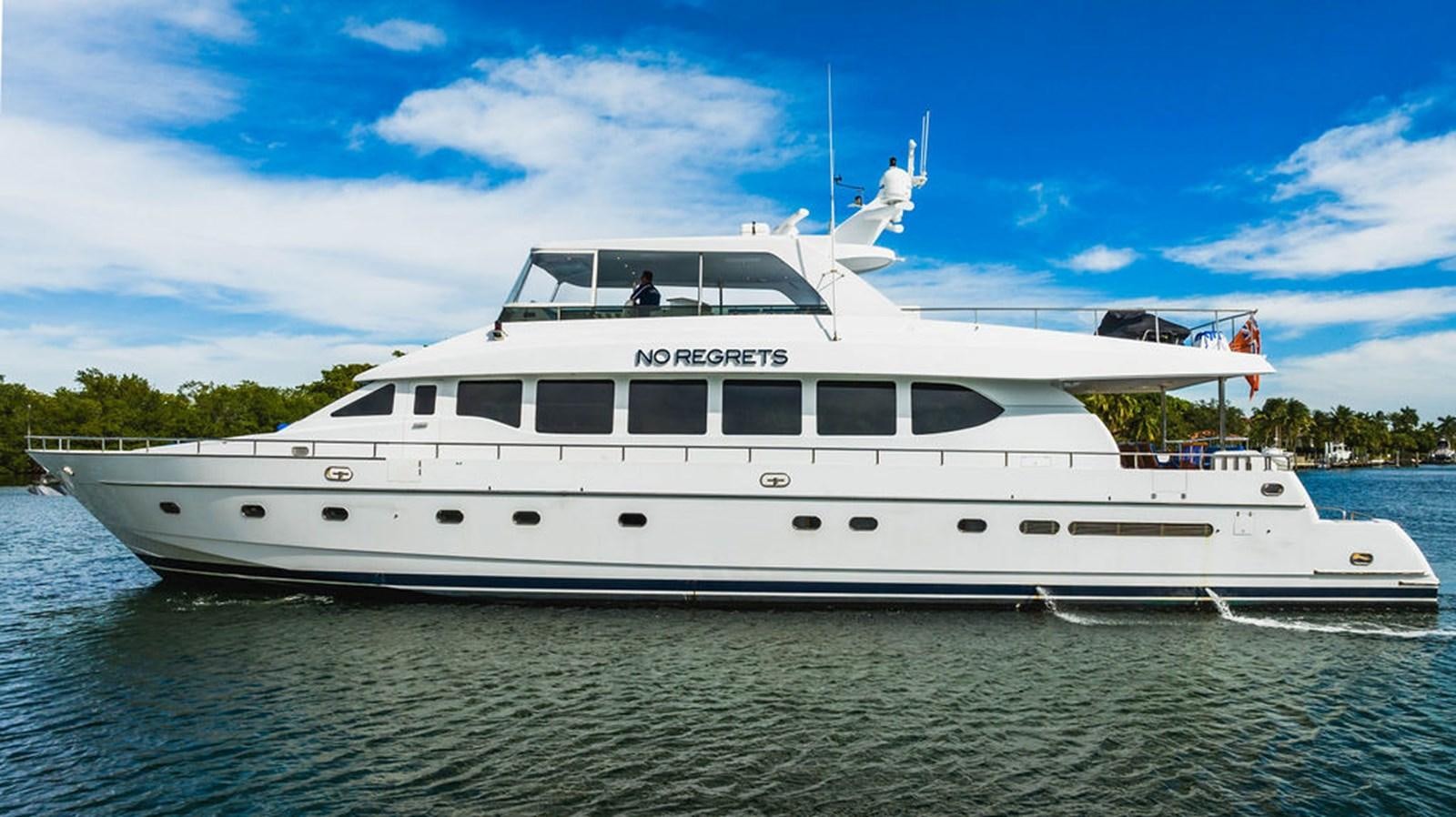 a large white boat in the water aboard NO REGRETS Yacht for Sale