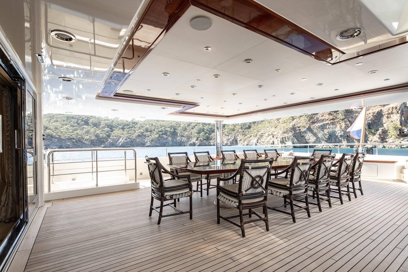 a room with a table and chairs aboard RICHAR Yacht for Sale