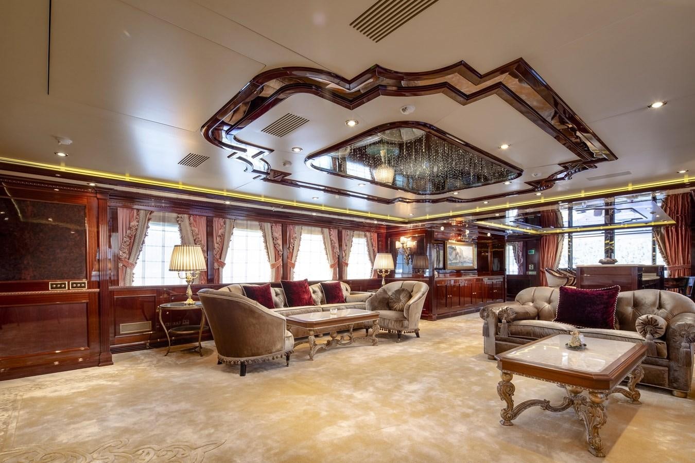 a large living room with a large chandelier aboard RICHAR Yacht for Sale