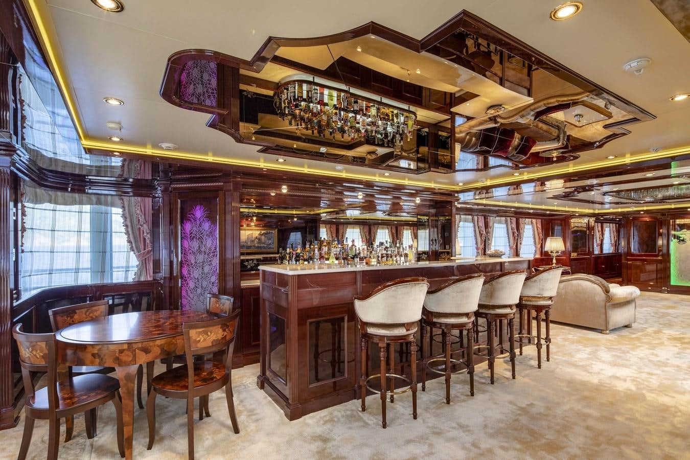 a restaurant with tables and chairs aboard RICHAR Yacht for Sale