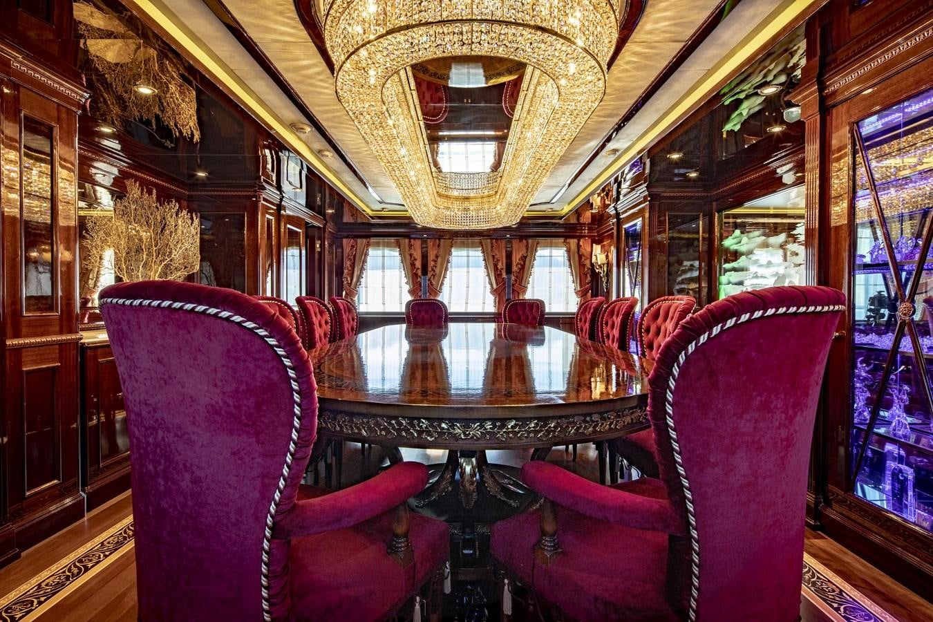 a room with chairs and a table aboard RICHAR Yacht for Sale