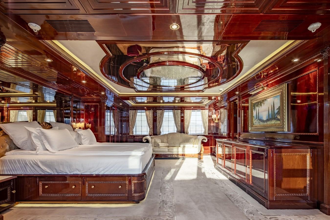 a room with a bed and a large mirror aboard RICHAR Yacht for Sale