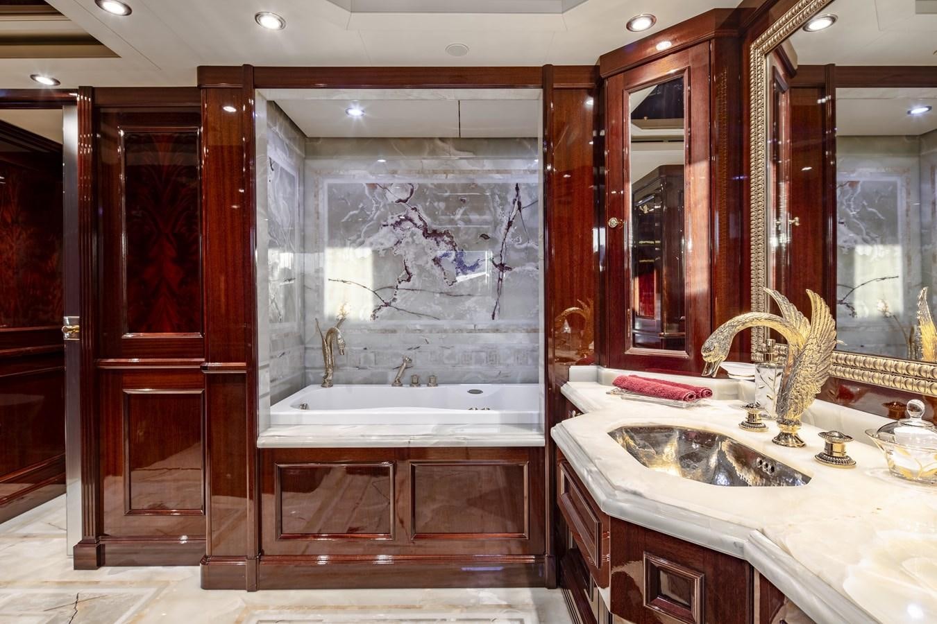 a bathroom with a large glass shower aboard RICHAR Yacht for Sale