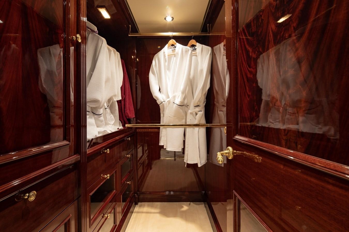 a closet with clothes in it aboard RICHAR Yacht for Sale