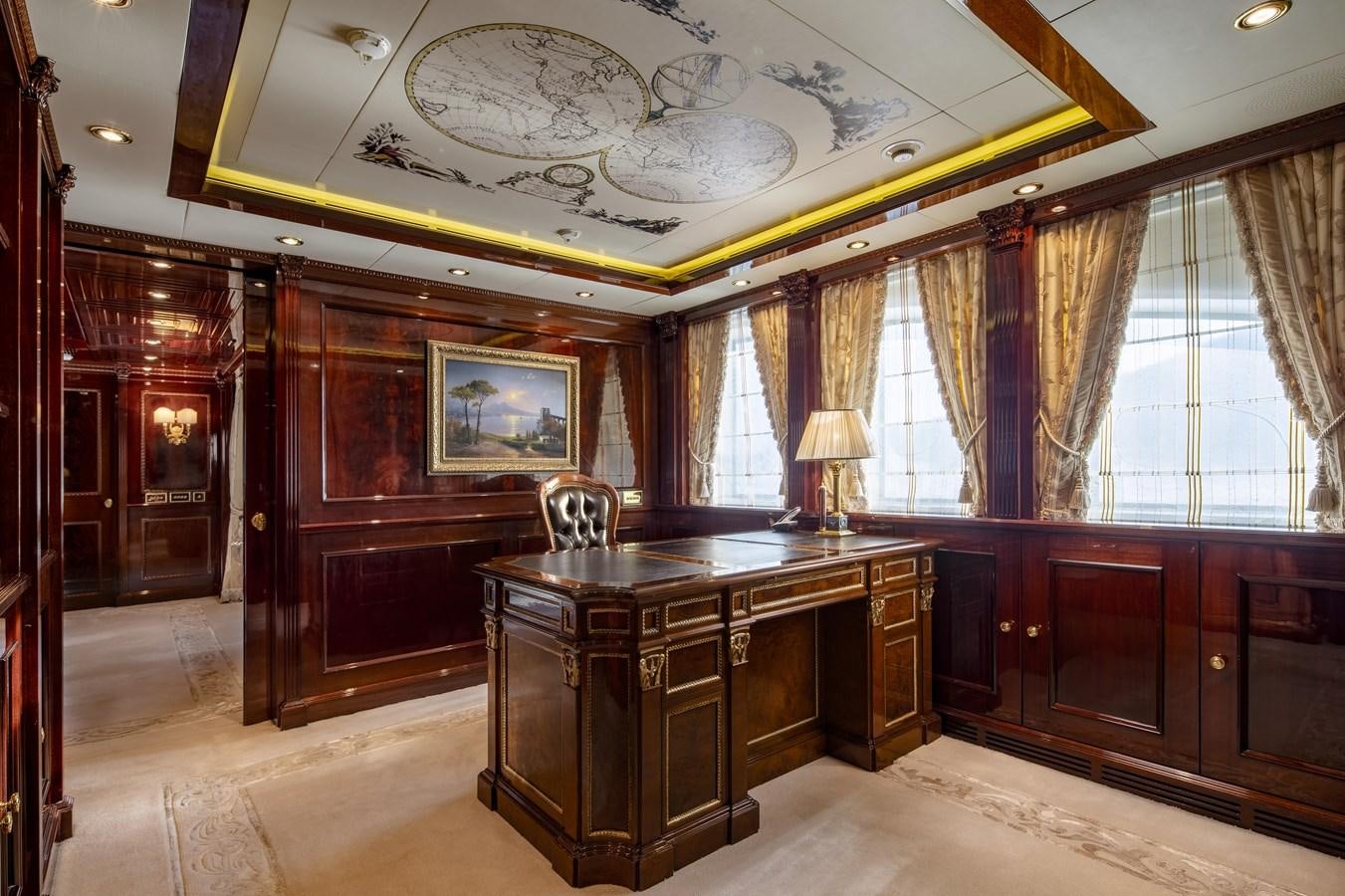 a large room with a large chandelier and a desk aboard RICHAR Yacht for Sale