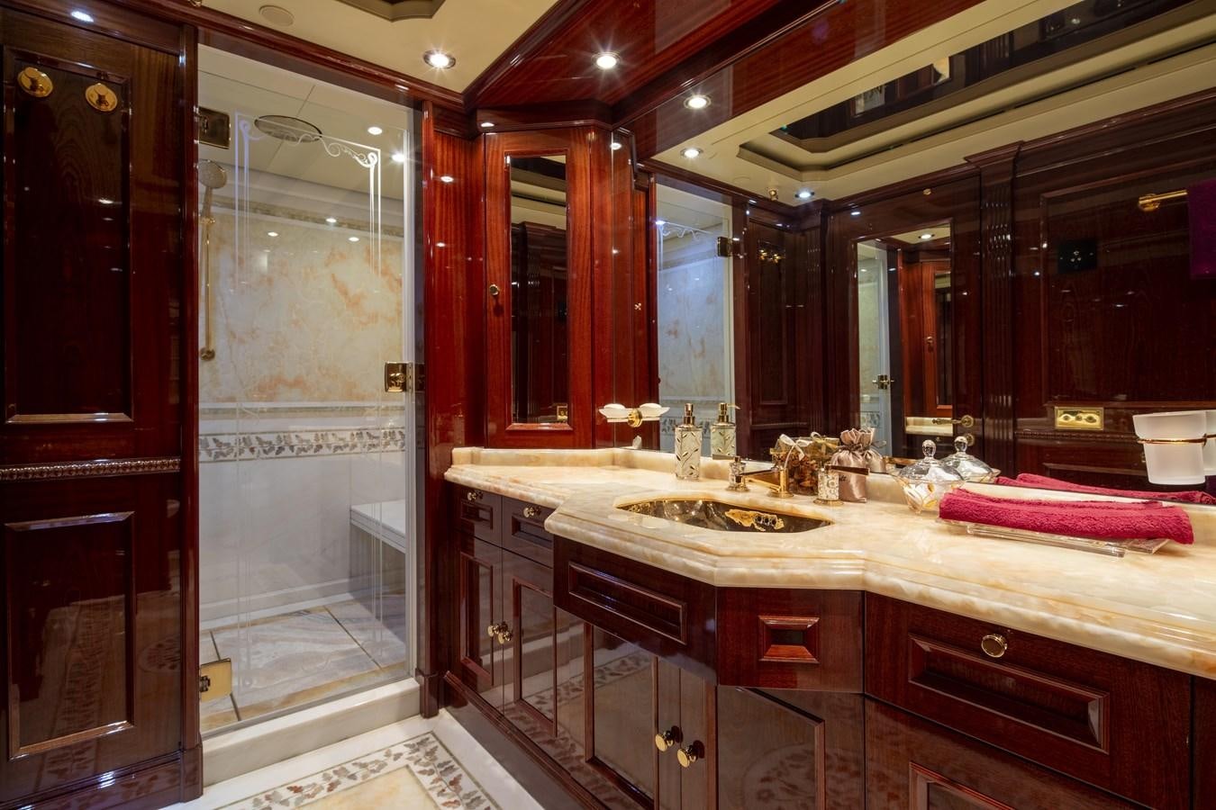 a bathroom with a large mirror aboard RICHAR Yacht for Sale