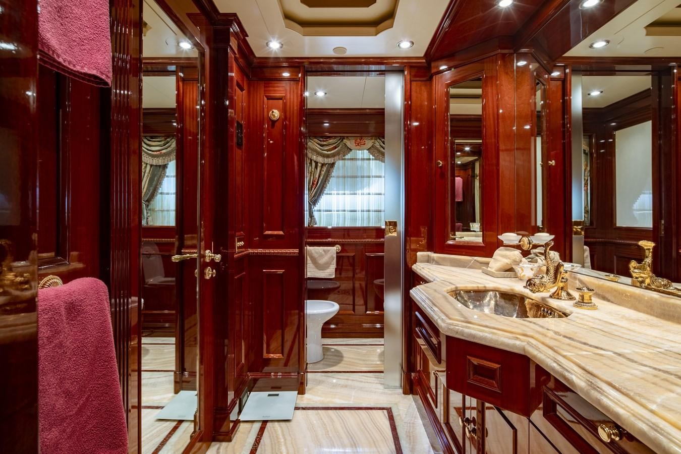 a bathroom with red walls aboard RICHAR Yacht for Sale
