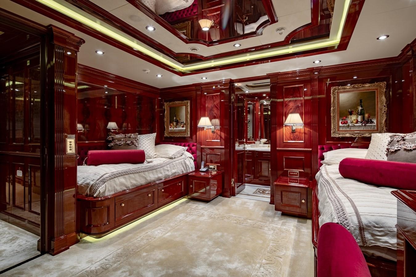 a room with red walls and a bed and a mirror aboard RICHAR Yacht for Sale