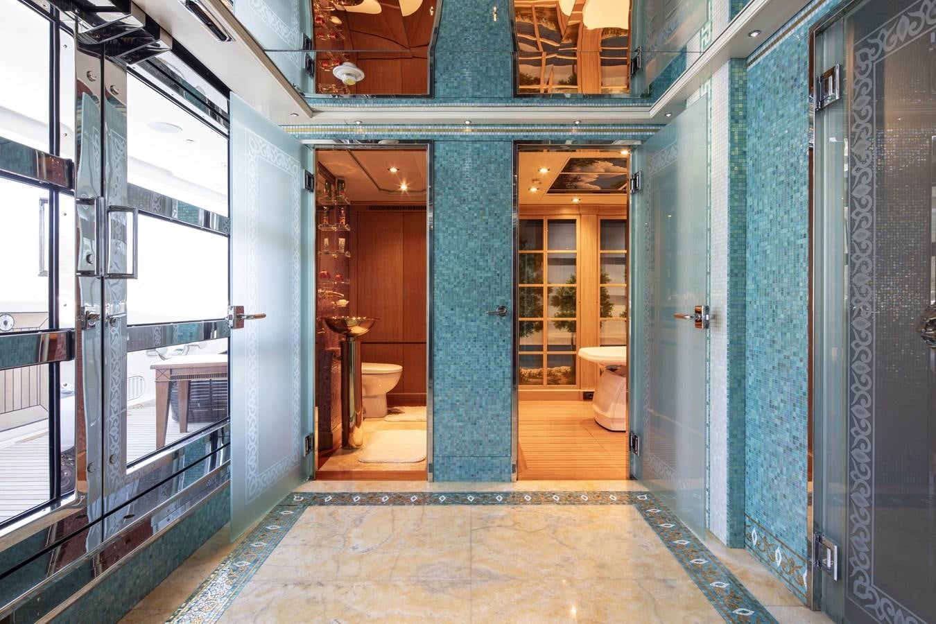 a room with blue walls and a tile floor aboard RICHAR Yacht for Sale