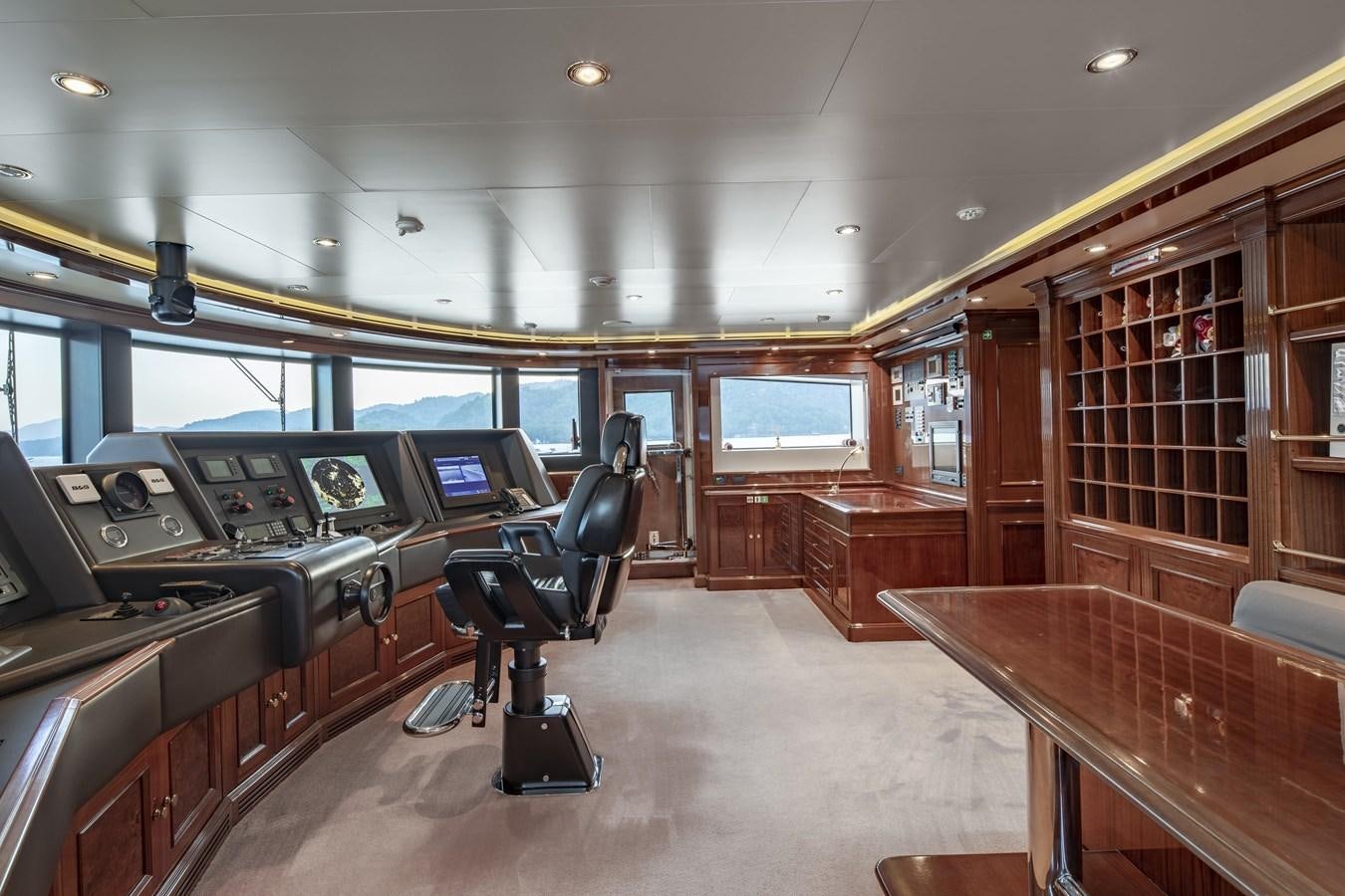 a room with a table and chairs aboard RICHAR Yacht for Sale