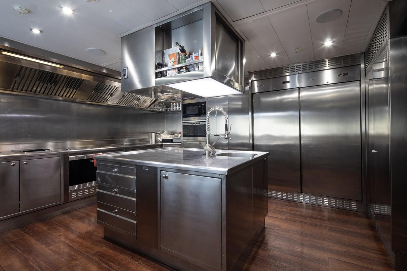 a kitchen with stainless steel appliances aboard RICHAR Yacht for Sale