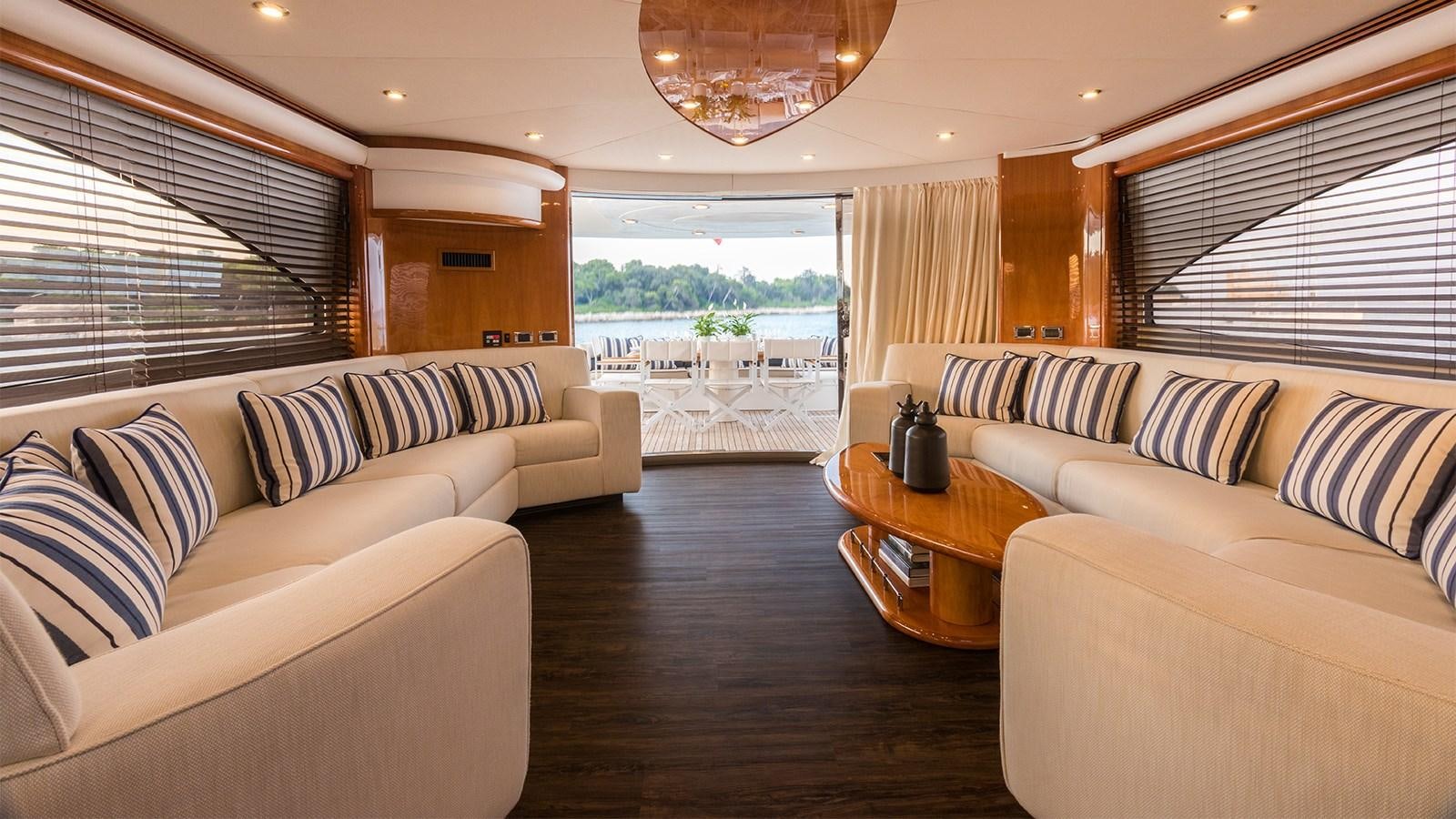 a living room with a couch and a table aboard WINNING STREAK 2 Yacht for Sale