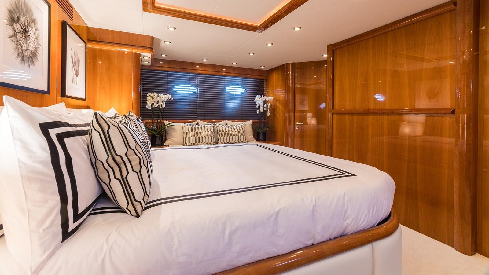 a bed with white sheets aboard WINNING STREAK 2 Yacht for Sale