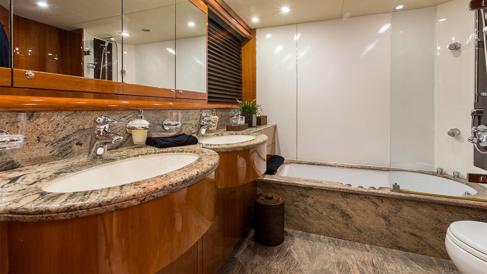 a bathroom with a large mirror aboard WINNING STREAK 2 Yacht for Sale