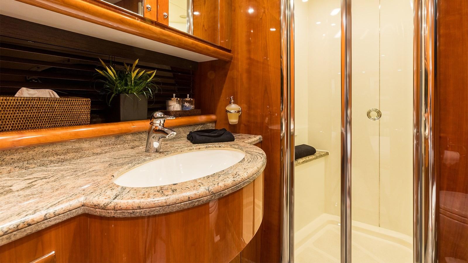 a bathroom with a sink and a shower aboard WINNING STREAK 2 Yacht for Sale