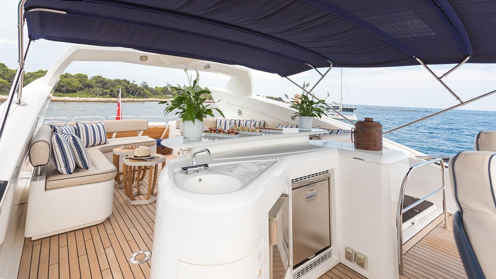 a white boat with a sink and chairs on a deck aboard WINNING STREAK 2 Yacht for Sale