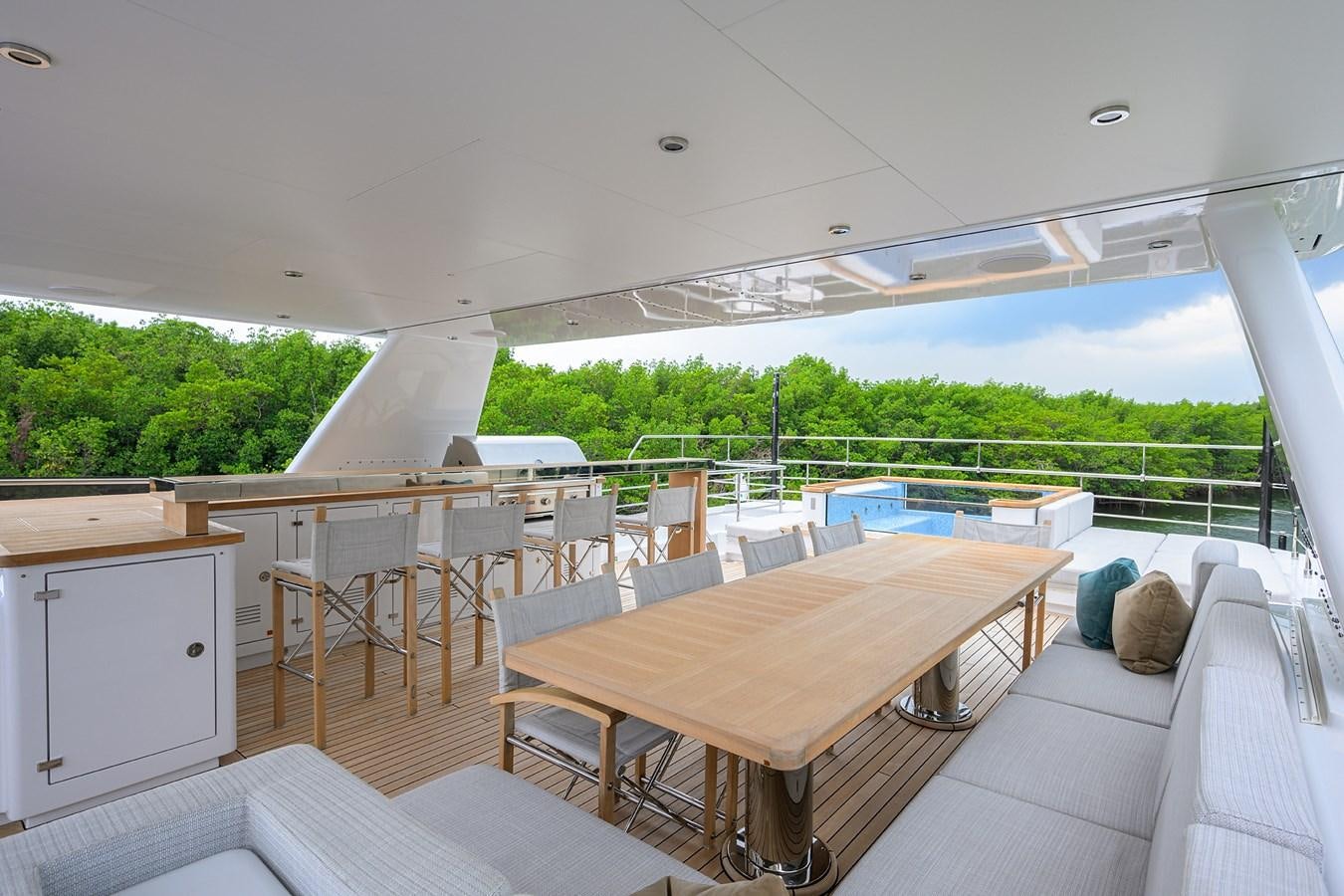 a room with a table and chairs aboard UPTIGHT Yacht for Sale