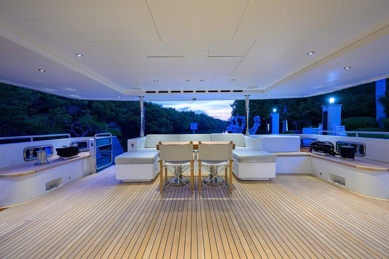 a room with a table and chairs aboard UPTIGHT Yacht for Sale