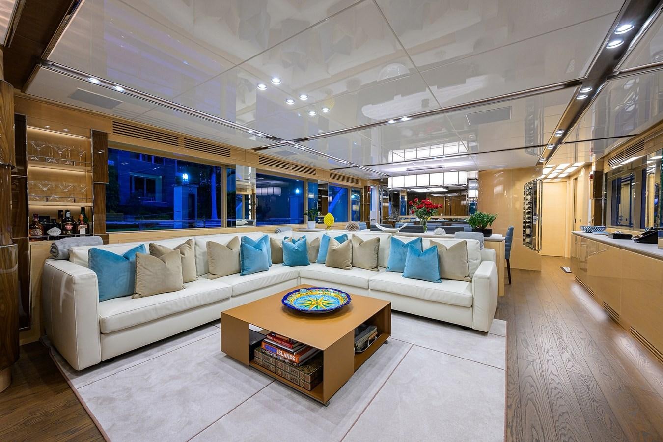 a living room with a couch and a table aboard UPTIGHT Yacht for Sale