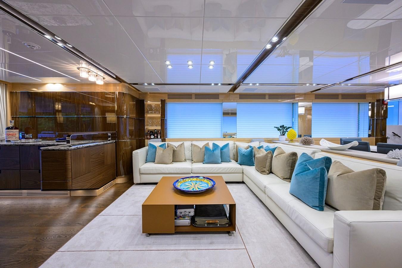 a living room with a couch and a table aboard UPTIGHT Yacht for Sale