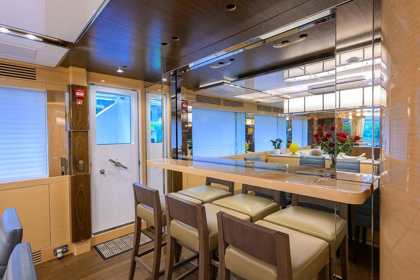 a room with a table and chairs aboard UPTIGHT Yacht for Sale