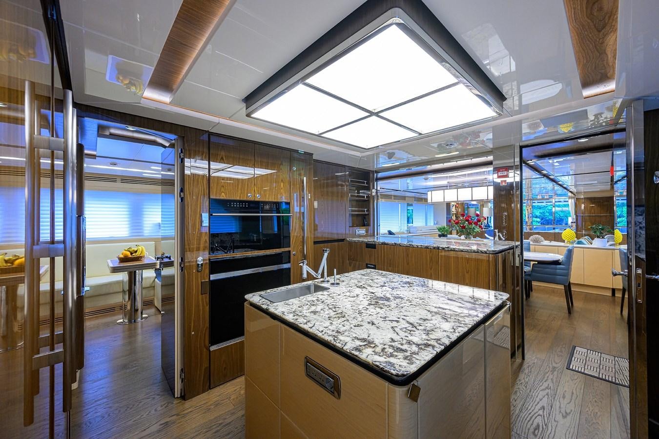 a kitchen with a large glass window aboard UPTIGHT Yacht for Sale