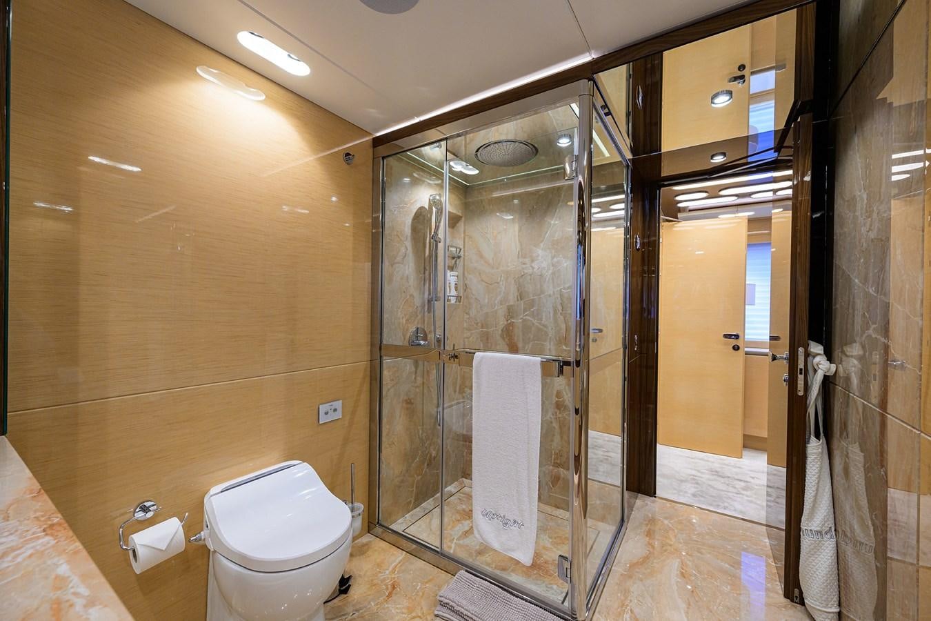 a bathroom with a glass shower aboard UPTIGHT Yacht for Sale