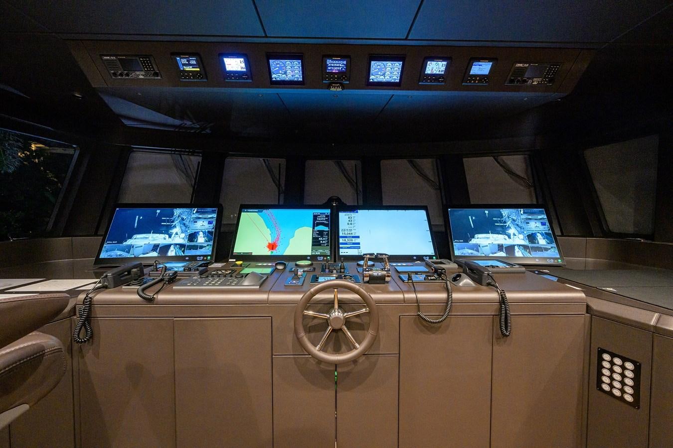 a control panel with several monitors aboard UPTIGHT Yacht for Sale