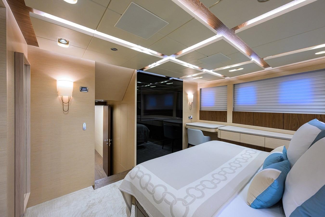 a room with beds and a window aboard UPTIGHT Yacht for Sale