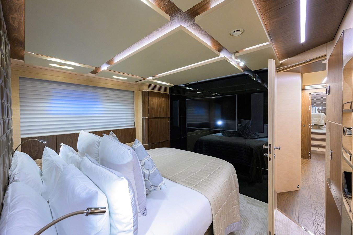 a room with a bed and a couch aboard UPTIGHT Yacht for Sale